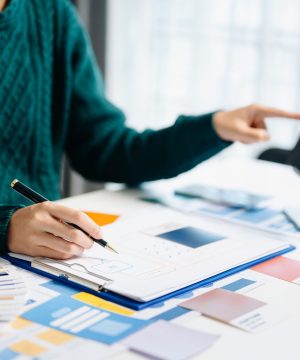 Close up view of UI developer team brainstorming on their project with laptop, smartphone and digital tablet. Creative digital development agency. with VR Icon
